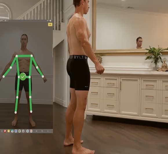Person completing a SNAP by Fit3D body scan with the measurement app overlay visible