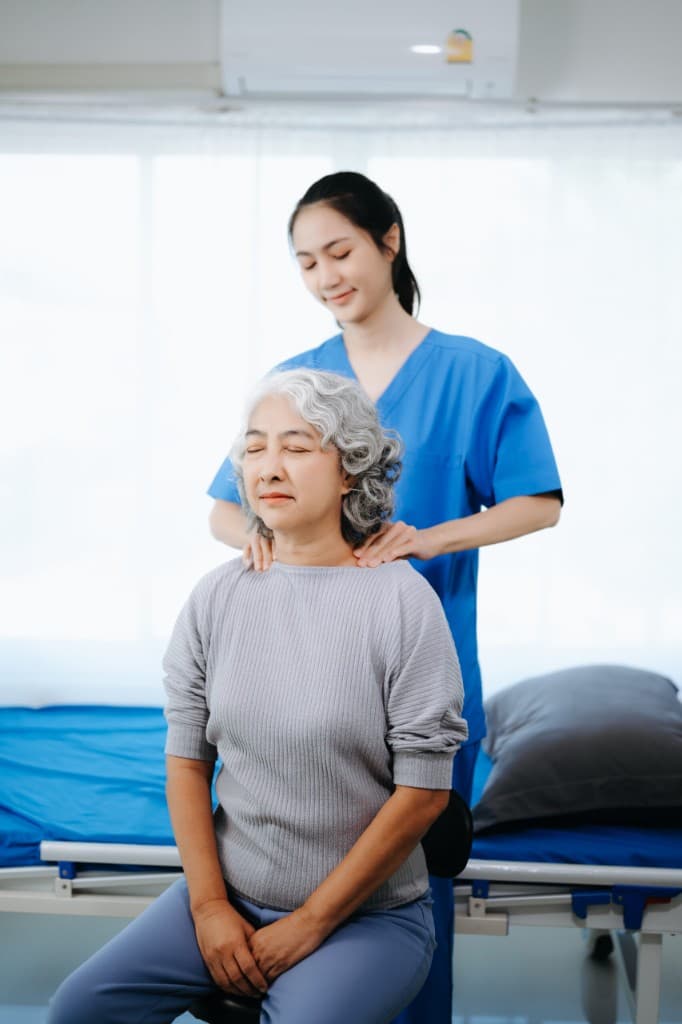 Pain management care at Oak & Sage Wellness Center — therapist supporting a patient